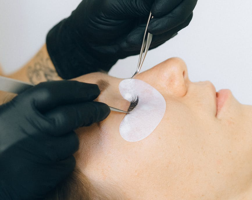 How many days before the wedding should brides schedule lash extension appointments?