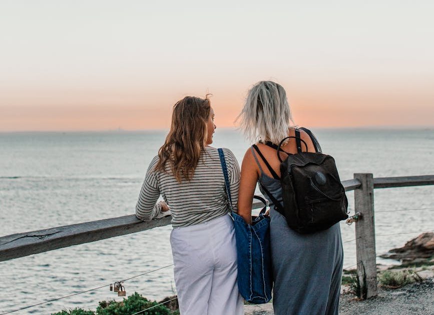 women looking at the ocean